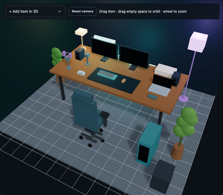 Actual RigMaster BuildLab 3D view of a sample gaming setup with dual monitors, a PC tower, laptop, console, speakers, chair, plants, lights and desk accessories.